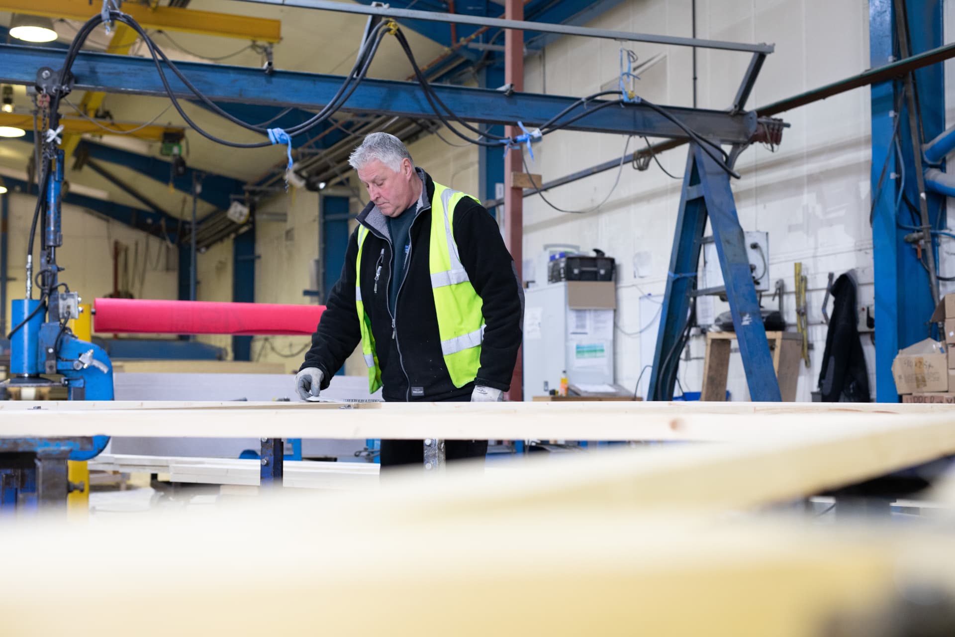 DTE joiner setting out a timber component in the workshop