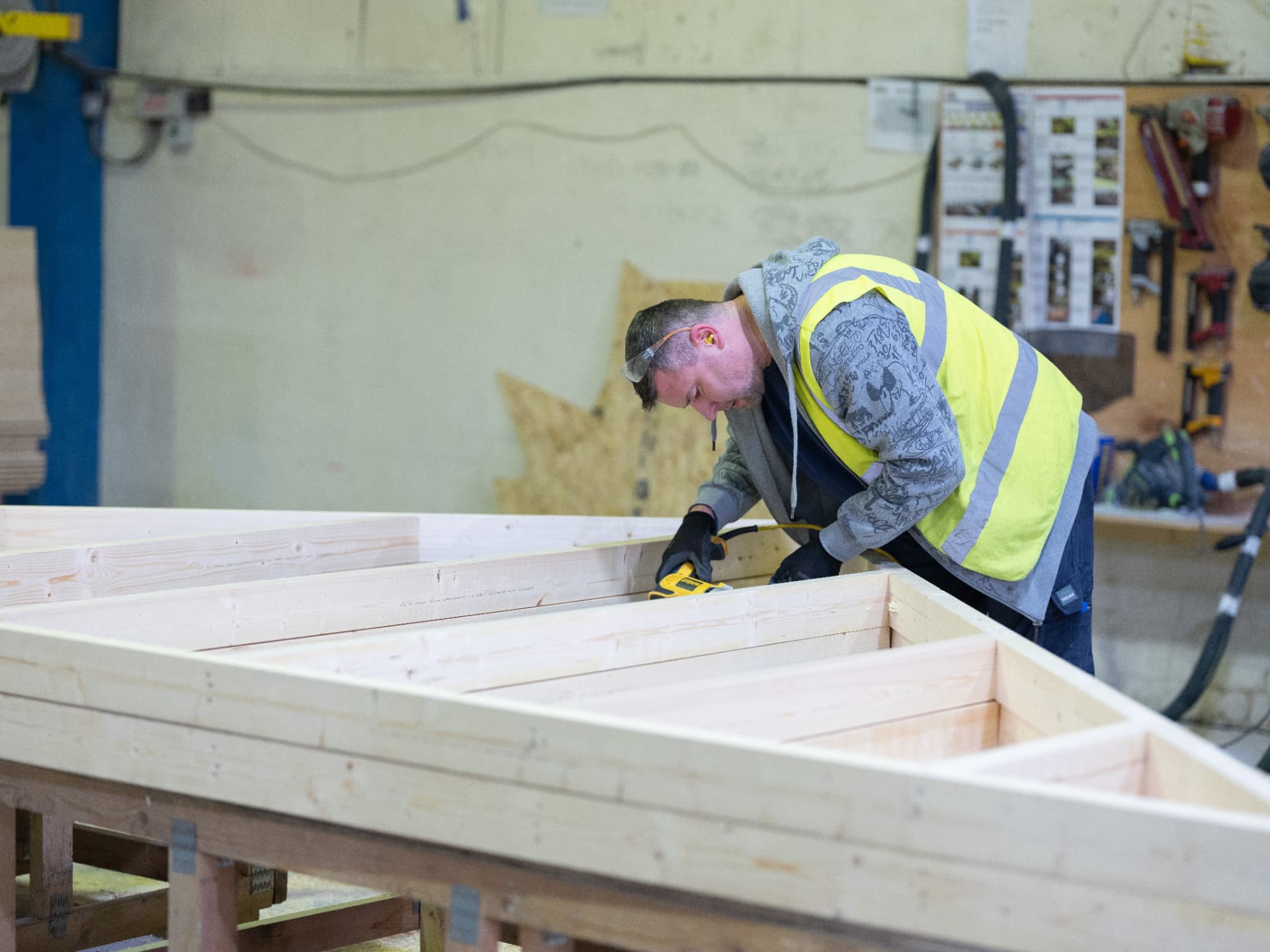 DTE joiner fixing studs into an open timber frame wall panel