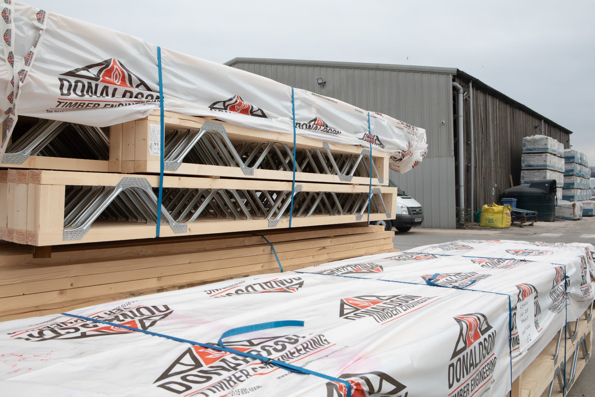 Branded DTE truss and joist packs stacked in the delivery yard